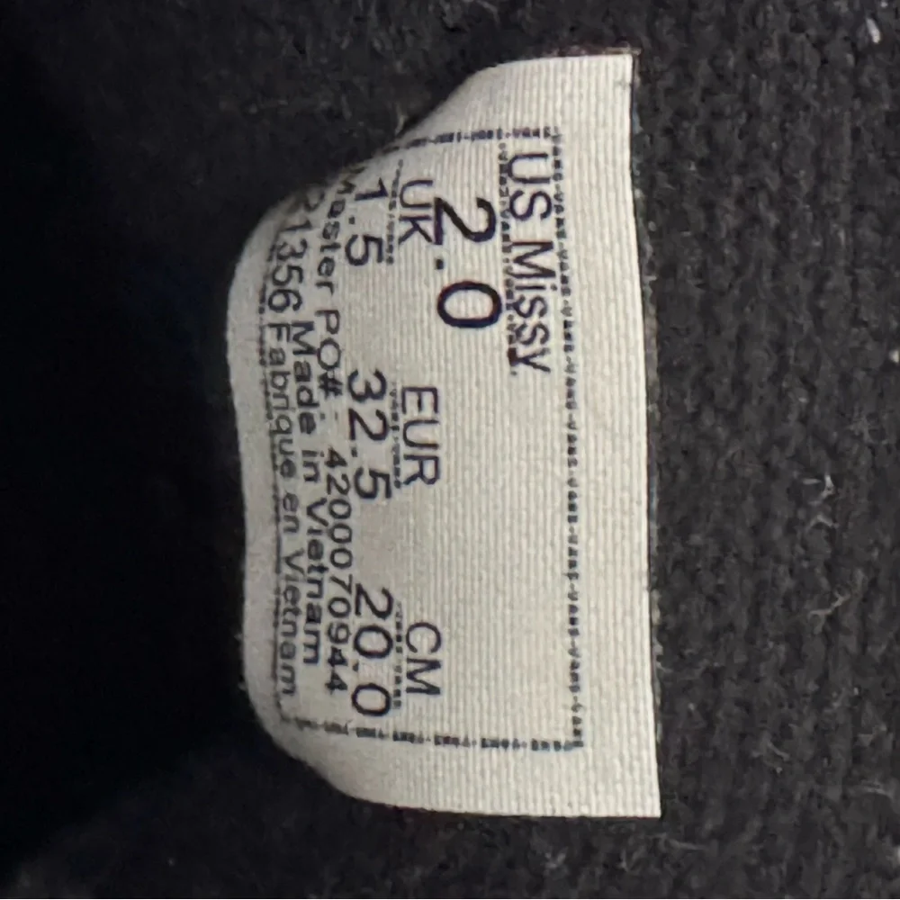 Vans Kid’s “Missy” Black and White High-Top Sneakers